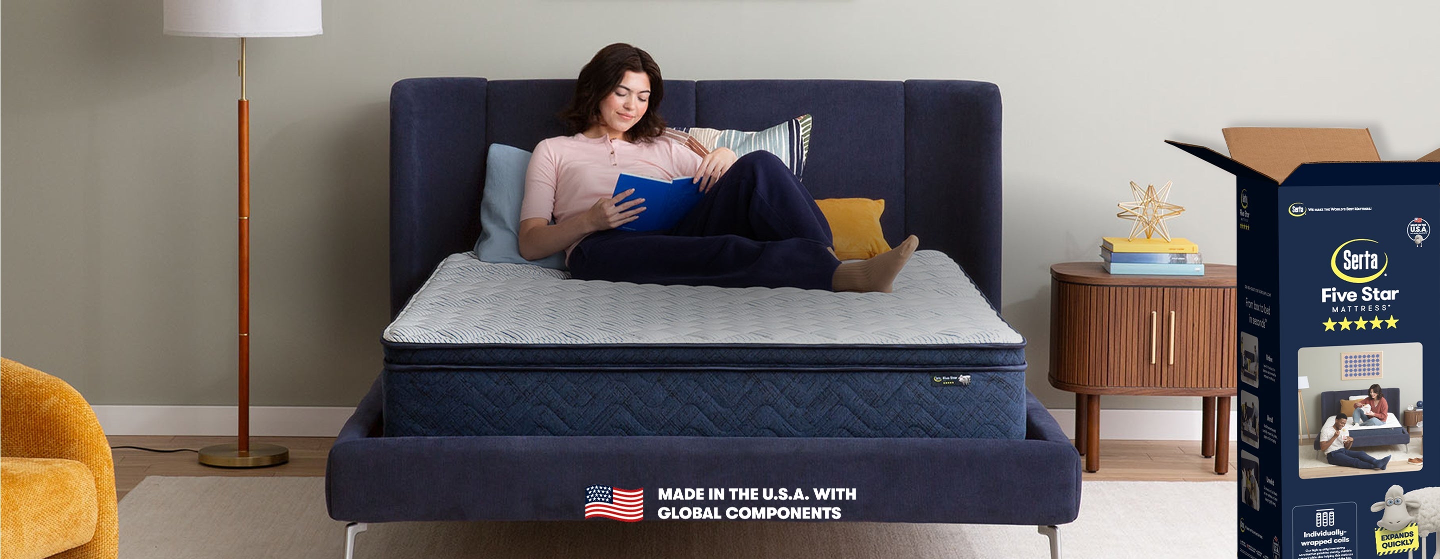 Woman laying on top of a Serta Five Star Mattress in Box reading a book.