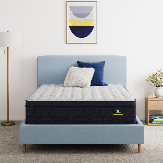 Serta Classic Clarks Hill 14.5" mattress sitting in a blue bed frame with 2 pillows on top of it.