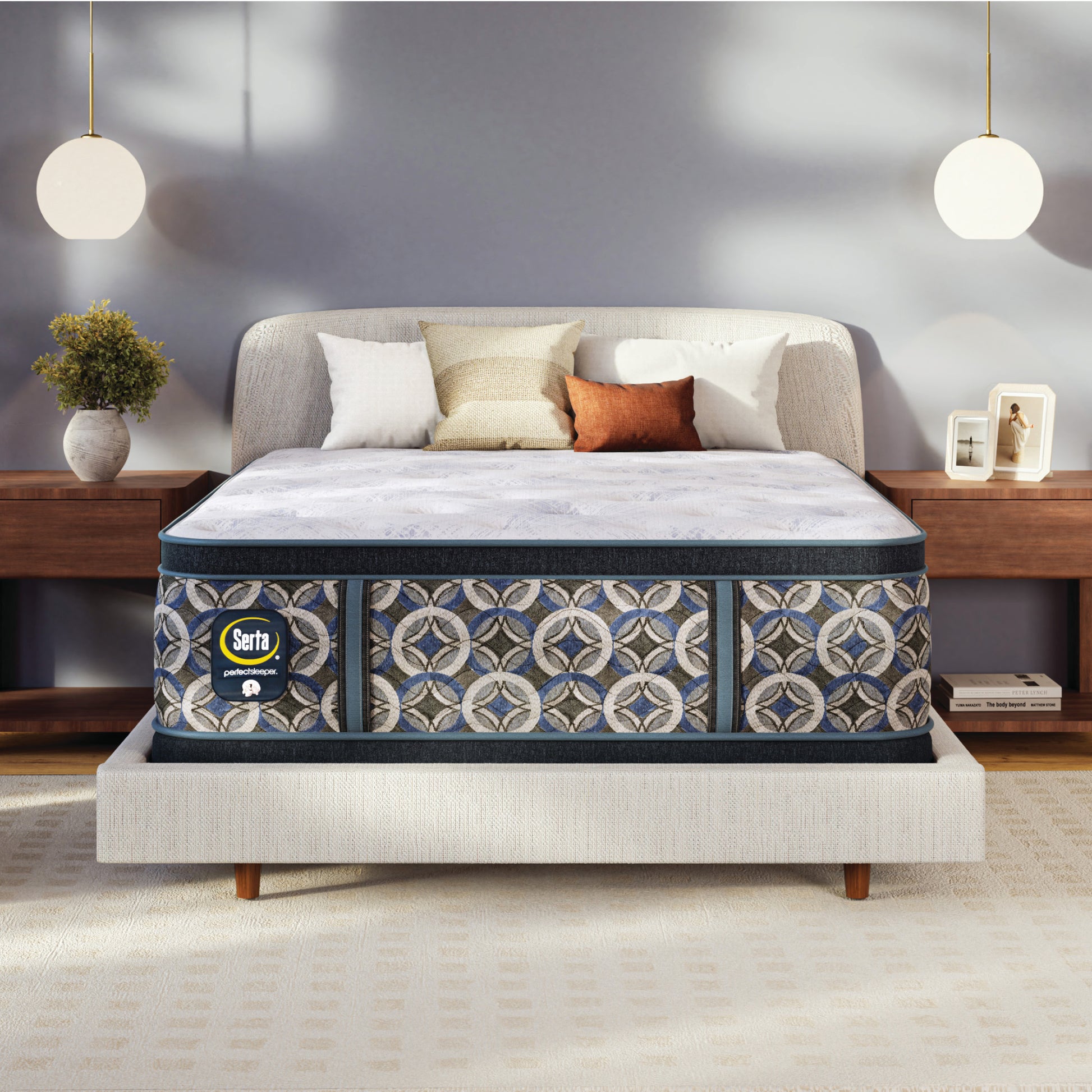 Serta perfect sleeper plush mattress on a bed in a bedroom setting with decor elements.