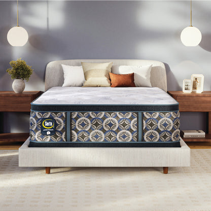Serta perfect sleeper plush mattress on a bed in a bedroom setting with decor elements.