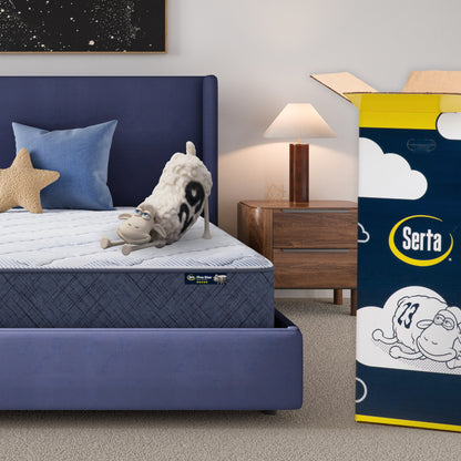 10 medium inch mattress in a blue bedframe with a Serta sheep with a number on top of it with the Serta packaging to the right of the bed