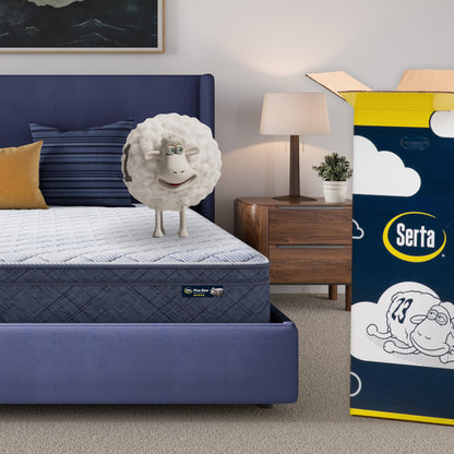 10 inch plush pillow top mattress in a blue bedframe with a Serta sheep with a number on top of it with the Serta packaging to the right of the bed