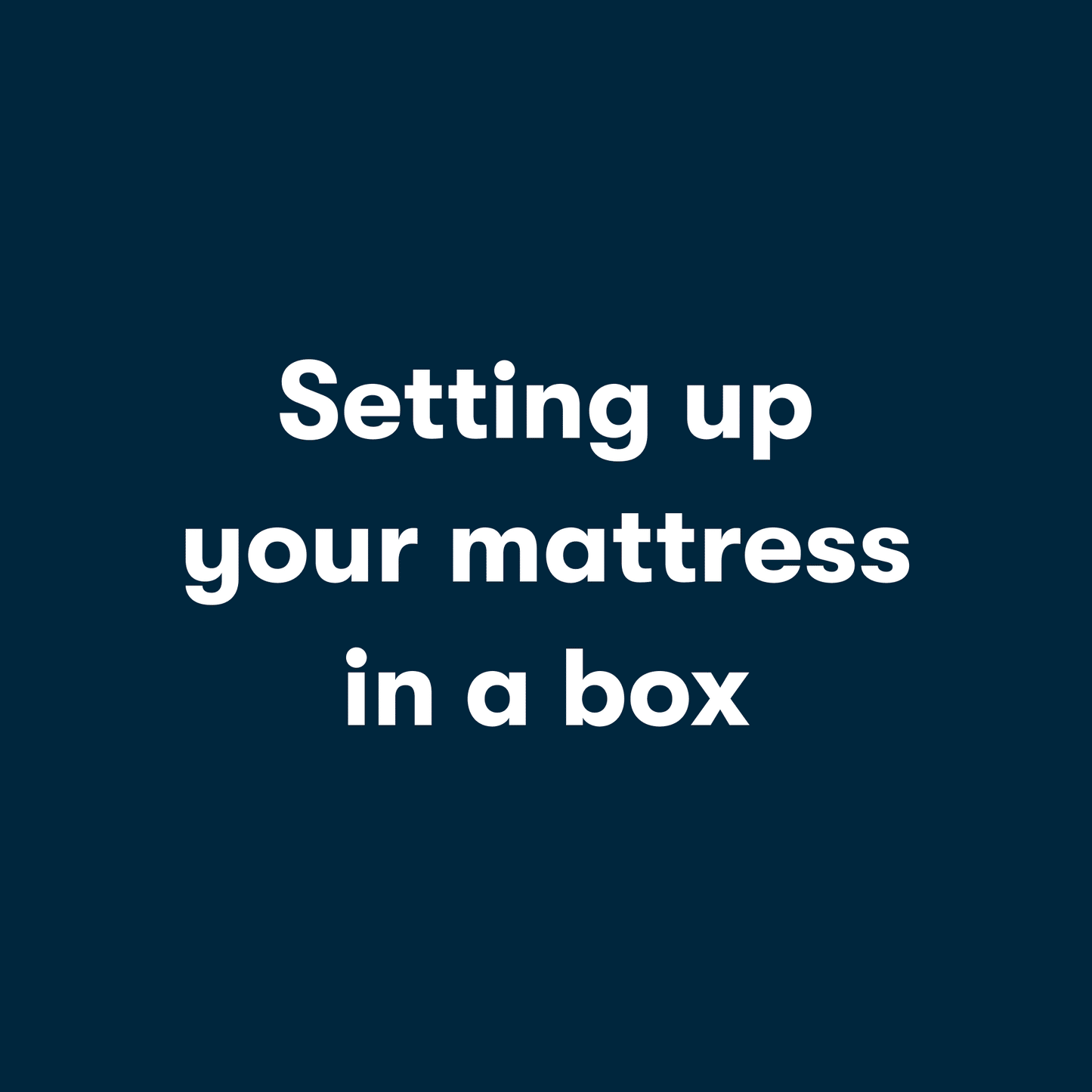 Gif video of a couple opening a mattress in a box, unrolling it and then laying on it.