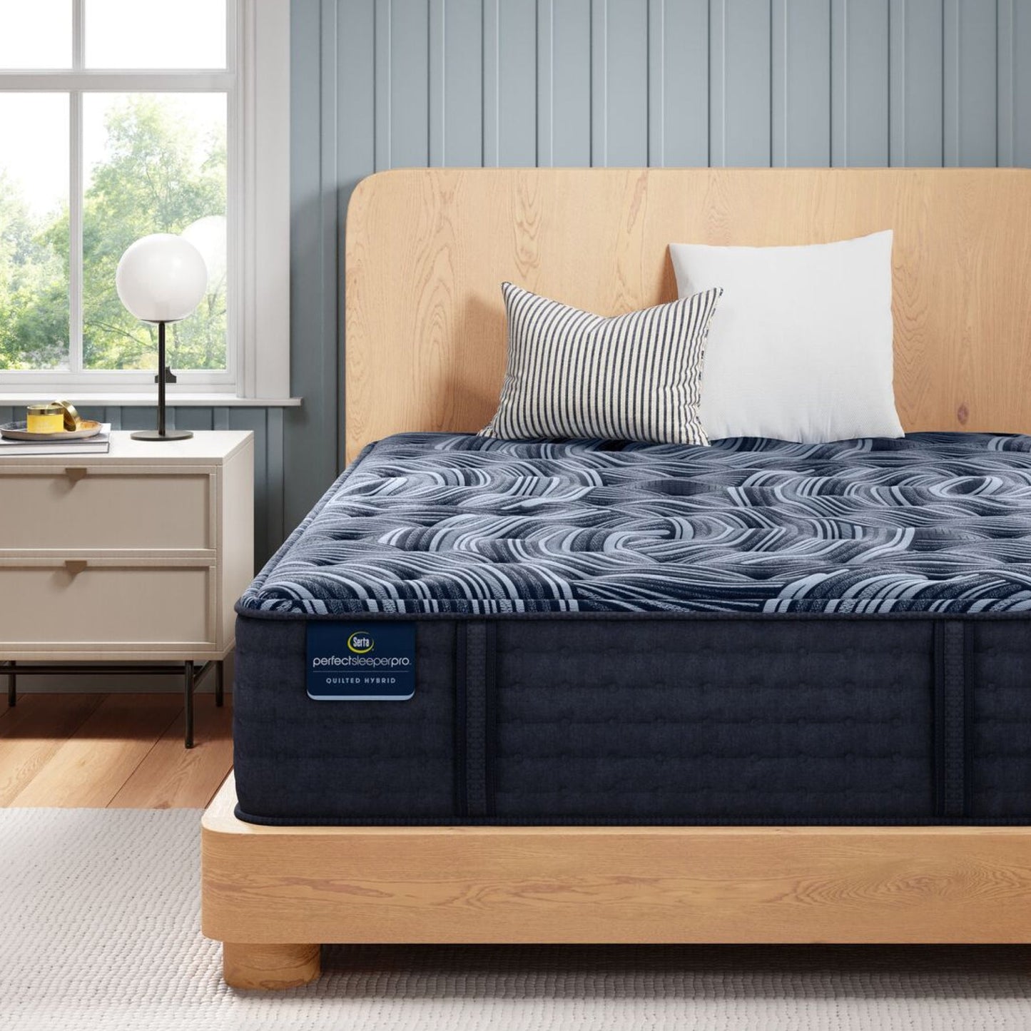 Perfect Sleeper Pro New Paris Medium mattress sitting in a brown bedframe || Level: Level 3 || Feel: Medium
