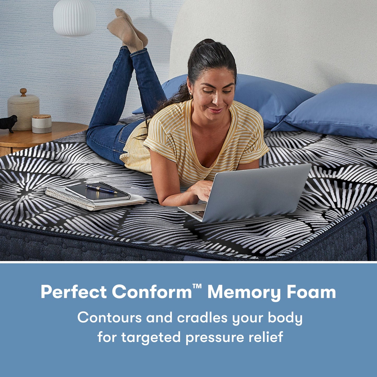Woman laying on her stomach using her laptop on a Perfect Sleeper X Quilted Hybrid Max Plush Pillow Top Mattress || feel: Plush Pillow Top || level: Level 2