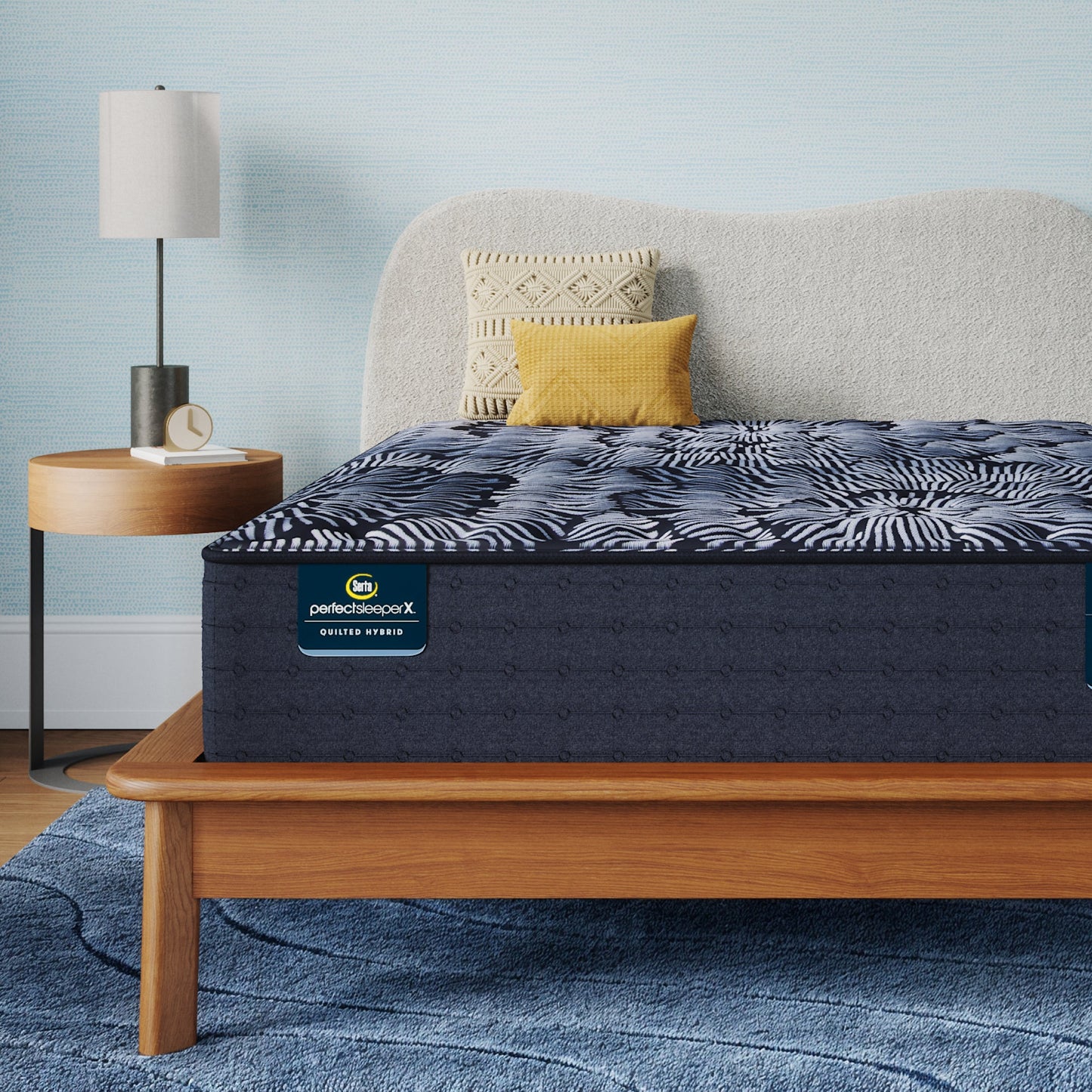 Perfect Sleeper X Quilted Hybrid Knox Firm Mattress sitting in a brown bedframe || feel: Firm || level: Level 1