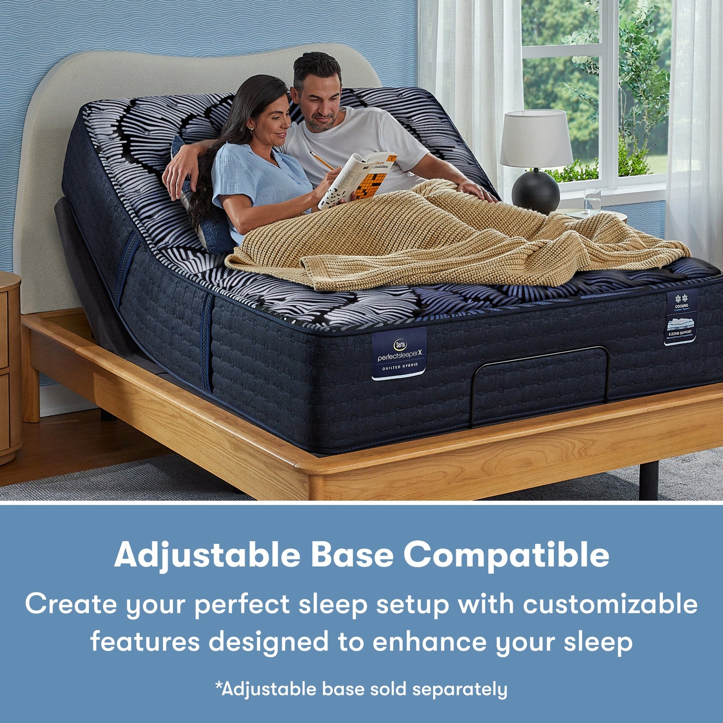 Man and woman sitting in a Perfect Sleeper X Quilted Hybrid Max Plush Pillow Top Mattress sitting in an adjustable base frame || feel: Plush Pillow Top || level: Level 2