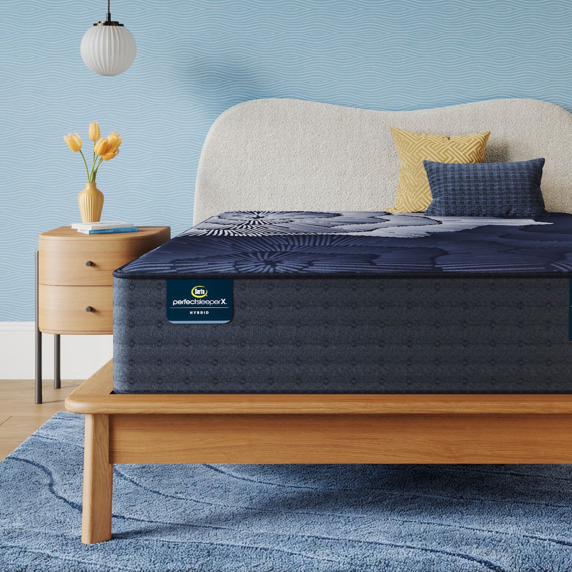 Perfect Sleeper X Hybrid Prescot Medium Firm Mattress sitting in a brown bedframe || feel: Medium Firm || level: Level 2