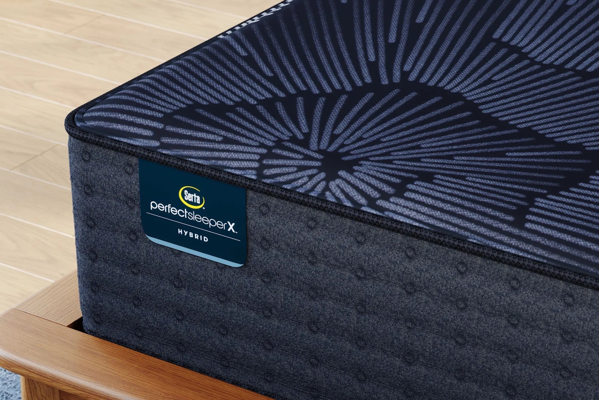 Close-up of a Serta Perfect Sleeper X Hybrid Medium Firm mattress, highlighting its 5-zone coil support, graphite-infused memory foam, and responsive micro coils for enhanced comfort.