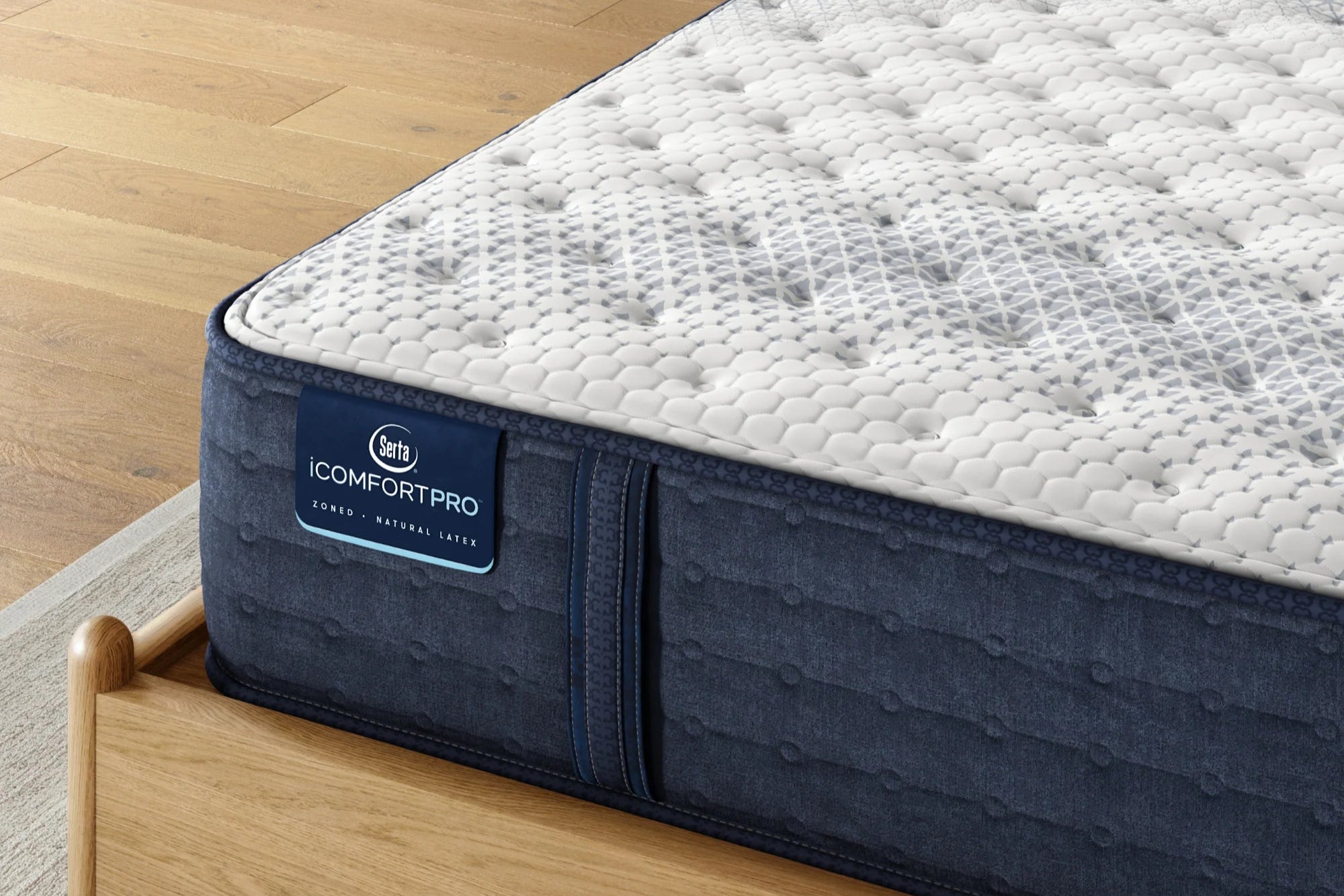 Close-up of a Serta iComfortPro Firm mattress, showcasing its firm support, responsive latex foam, and cooling fabric for improved spinal alignment.