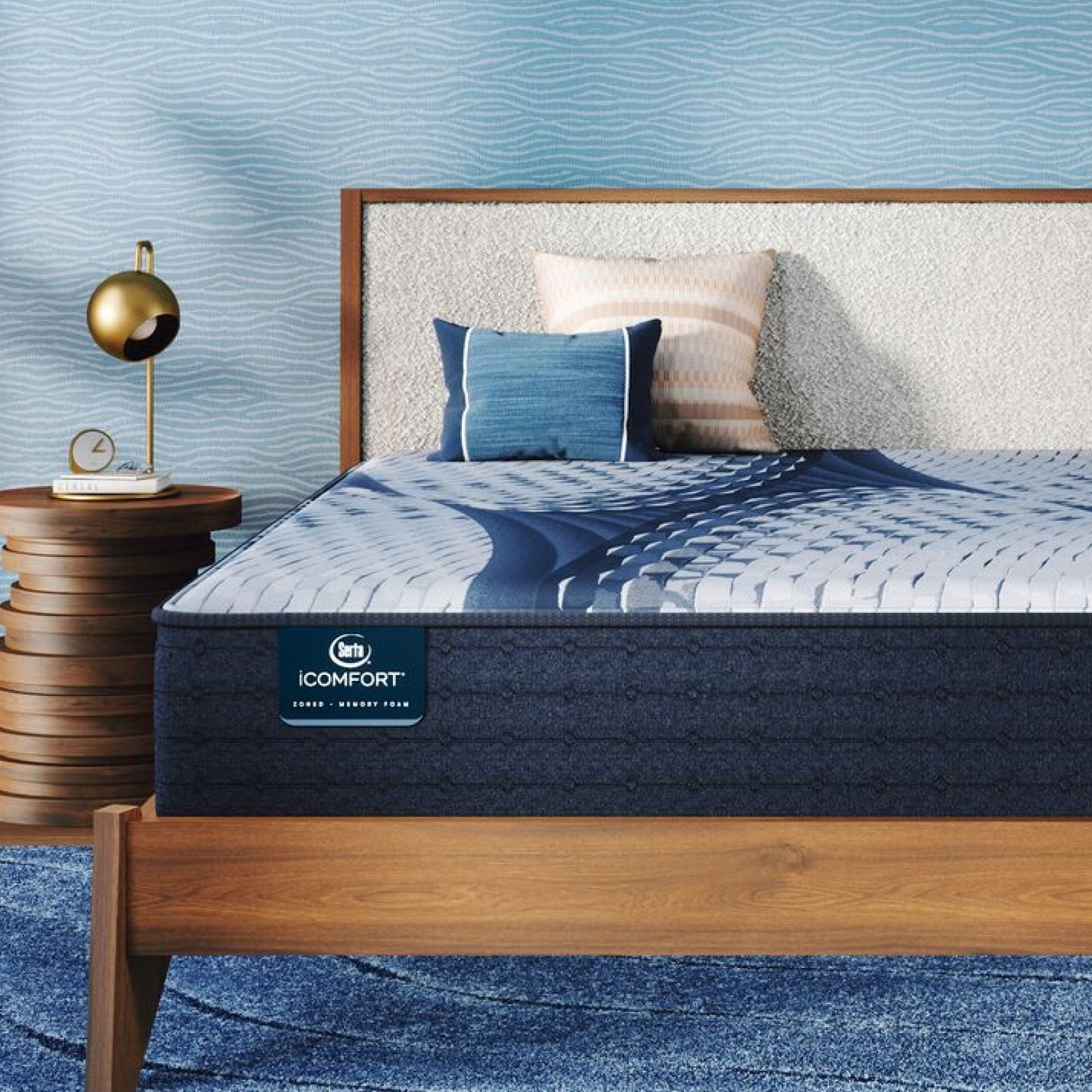 iComfort Aveda Medium Mattress sitting in a brown bedframe || feel: medium || level: Standard - 12"