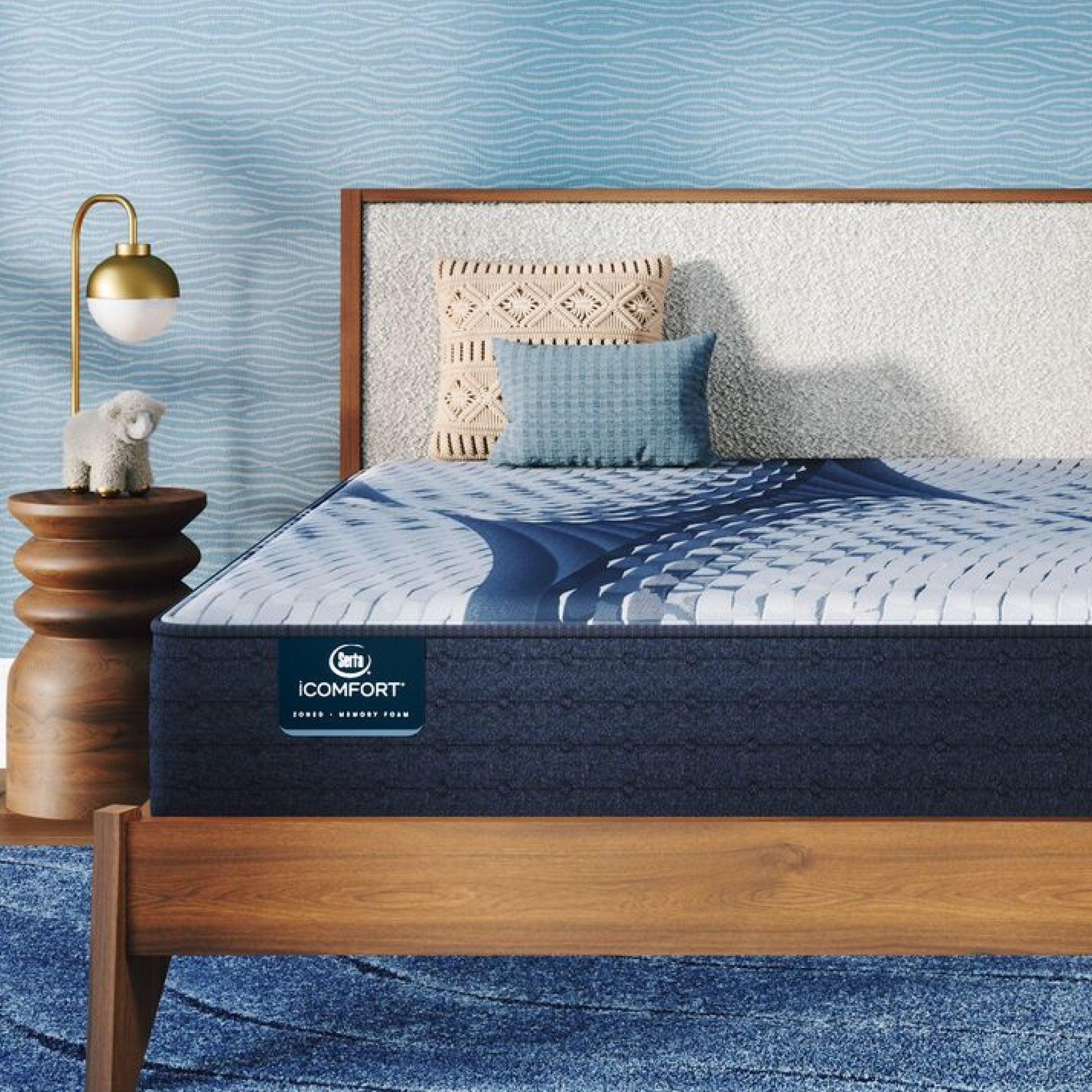 iComfort Elana Firm Mattress sitting in a brown bedframe || feel: firm || level: Standard - 11.5"