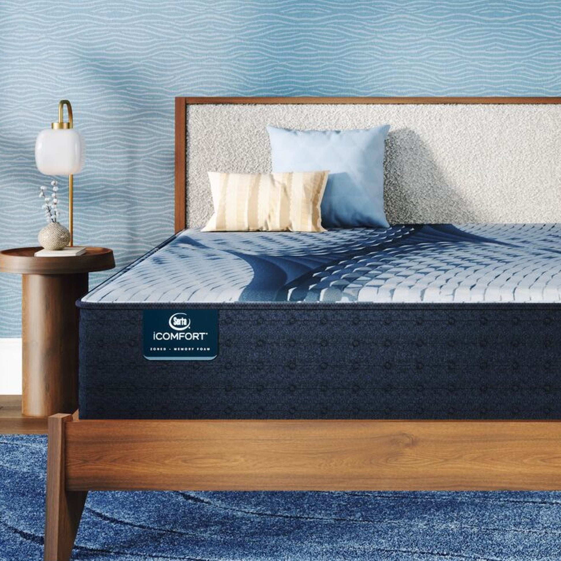iComfort Iona Medium Mattress sitting in a brown bedframe || feel: medium || level: Standard - 13"