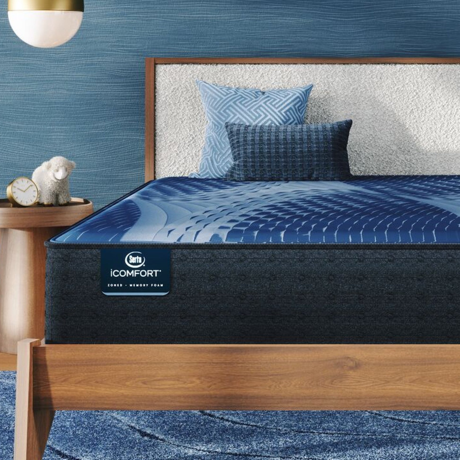 iComfort Aspire Medium Mattress sitting in a brown bedframe || feel: medium || level: Enhanced - 14"