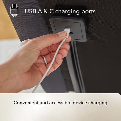 Hand plugging a USB cable into a Baselogic Pearl adjustable base USB A & C charging port.