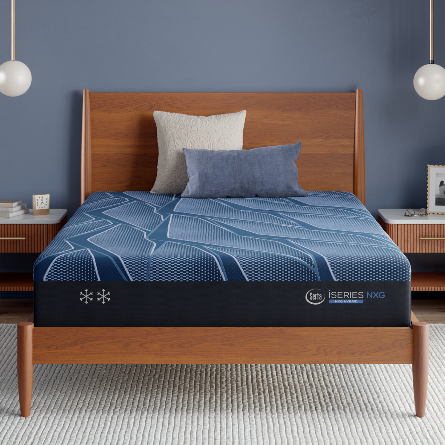Blue Serta® iSeries® NXG™ Mattress mattress on a wooden bed frame with a gray wall and nightstands.