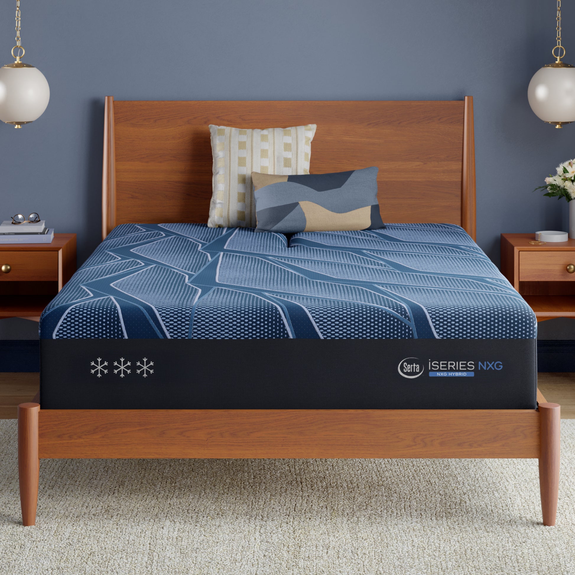 Blue Serta® iSeries® NXG™ mattress with brand logo on a wooden bed in a bedroom setting