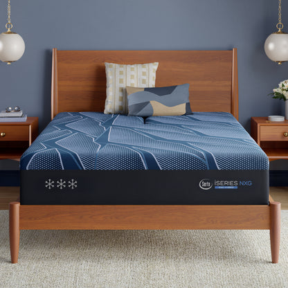 Blue Serta® iSeries® NXG™ mattress with brand logo on a wooden bed in a bedroom setting