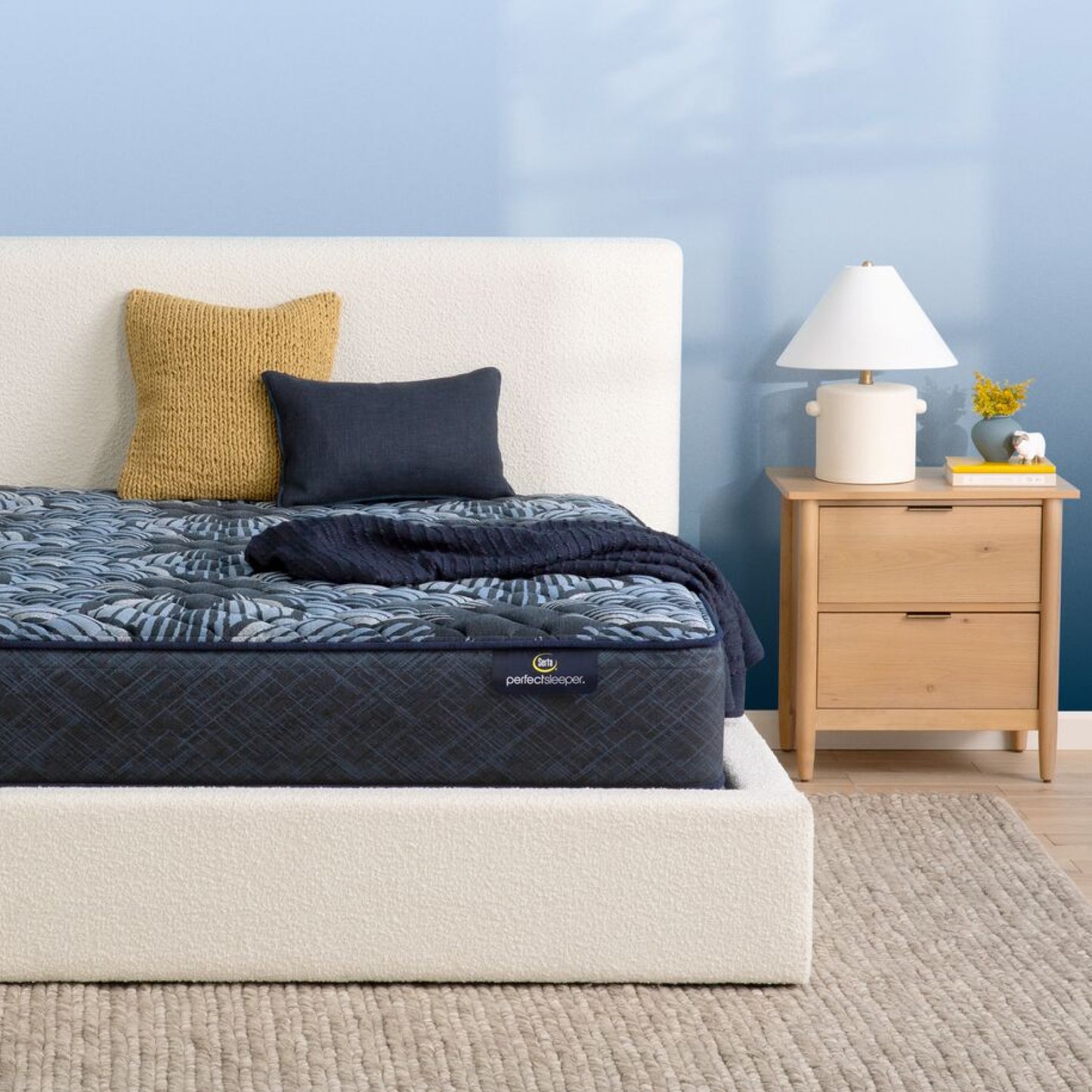 The Serta Perfect Sleeper Sleep Excellence mattress in a bedroom on a white bed | feel: Firm