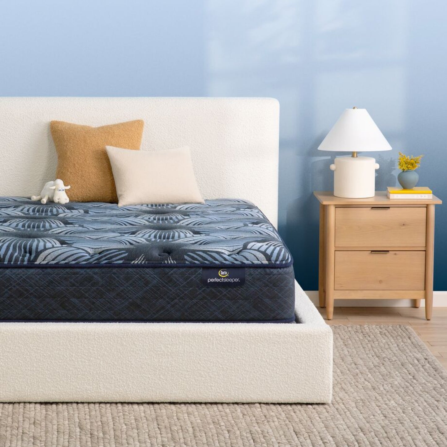 The Serta Perfect Sleeper Sleep Excellence mattress in a bedroom on a white bed | feel: plush