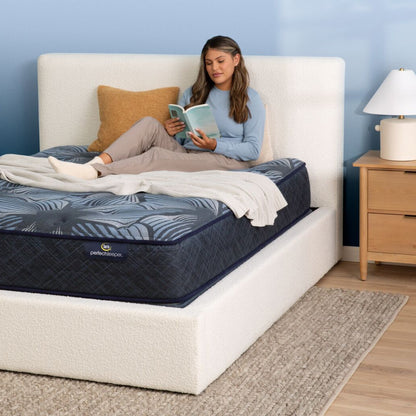A woman reading in bed on the Serta Perfect Sleeper Sleep Excellence mattress | feel: medium pillow top