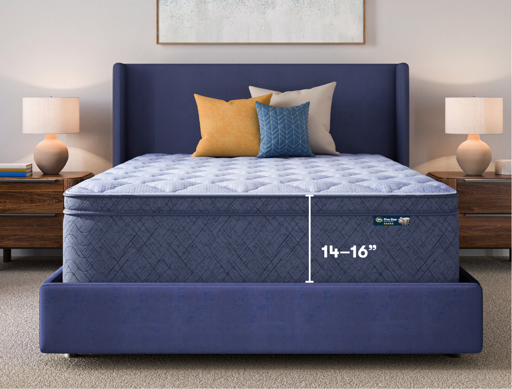 16 inch Serta 5 Star mattress in a blue bed frame with 3 pillows on top of it.