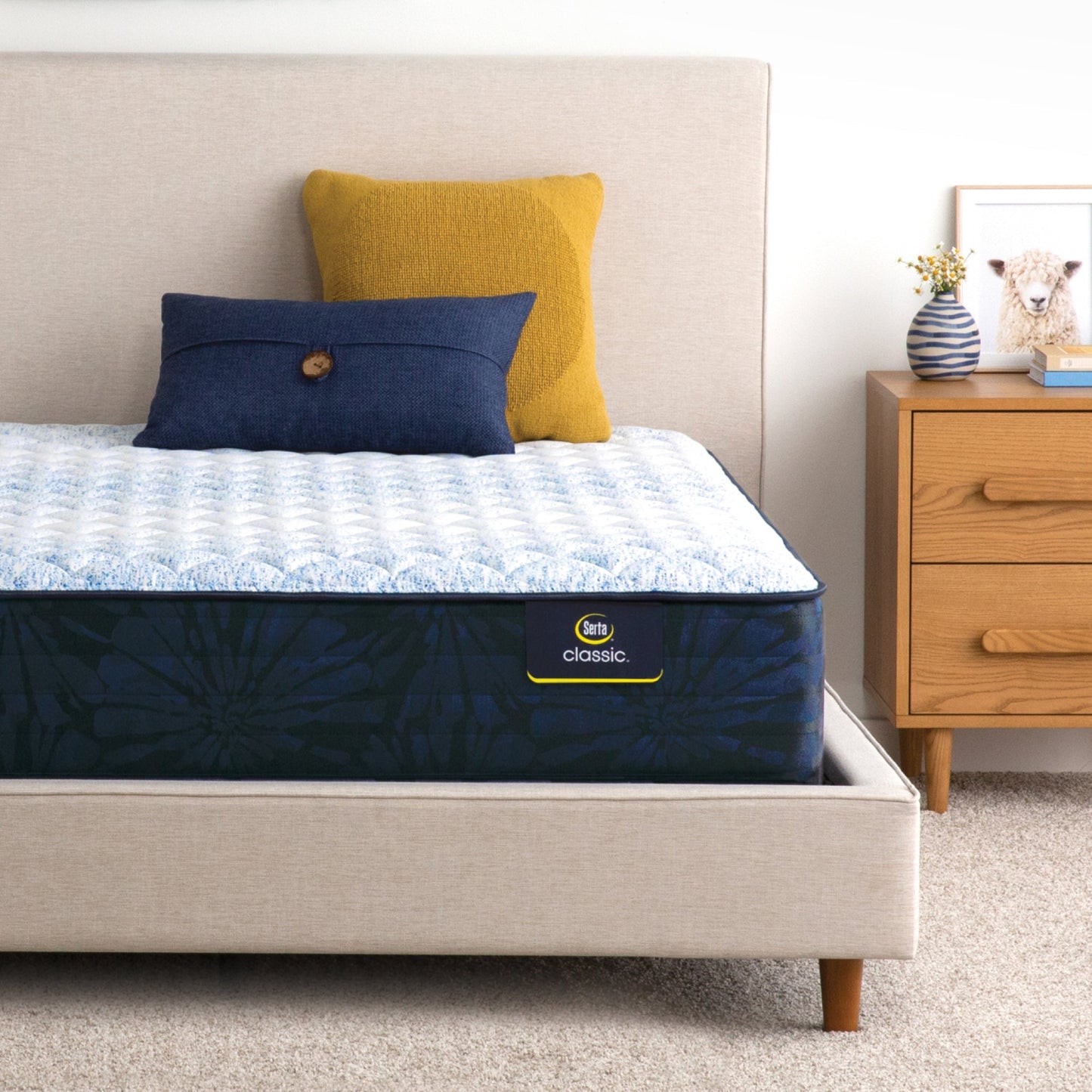 Serta classic alden medium mattress sitting in a beige bed frame ||feel: medium ||level: standard