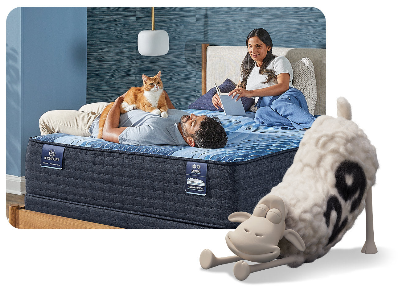 A man and his wife lay on a Serta iComfort mattress. The man is cuddling his orange cat while his wife reads a book.